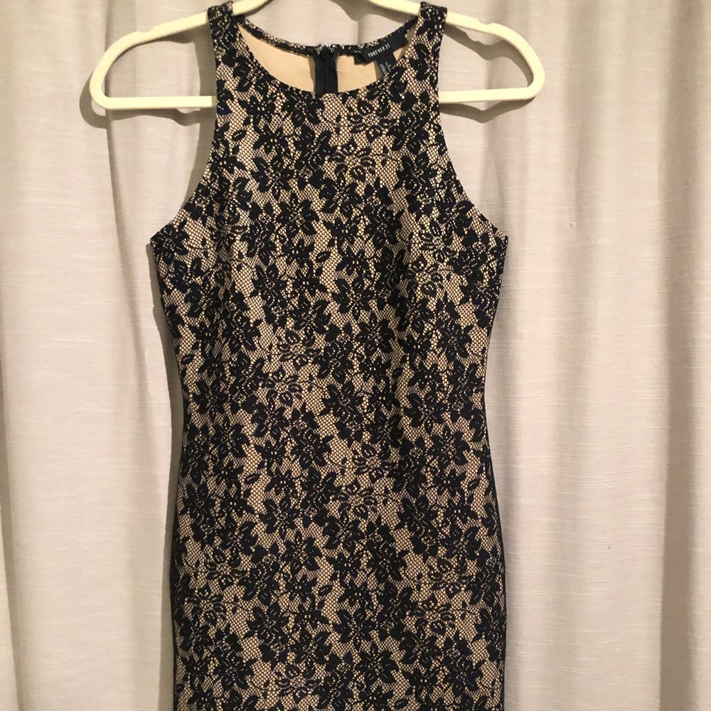 Nude dress with black lace overlay
